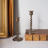 pair of small, twisted candlestick holders