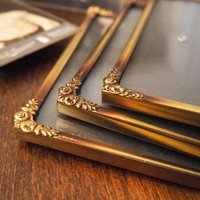 Set of three vintage brass photo frames | Brass photo frames 13x18 cm | Vintage brass picture frames | Vintage floral frames