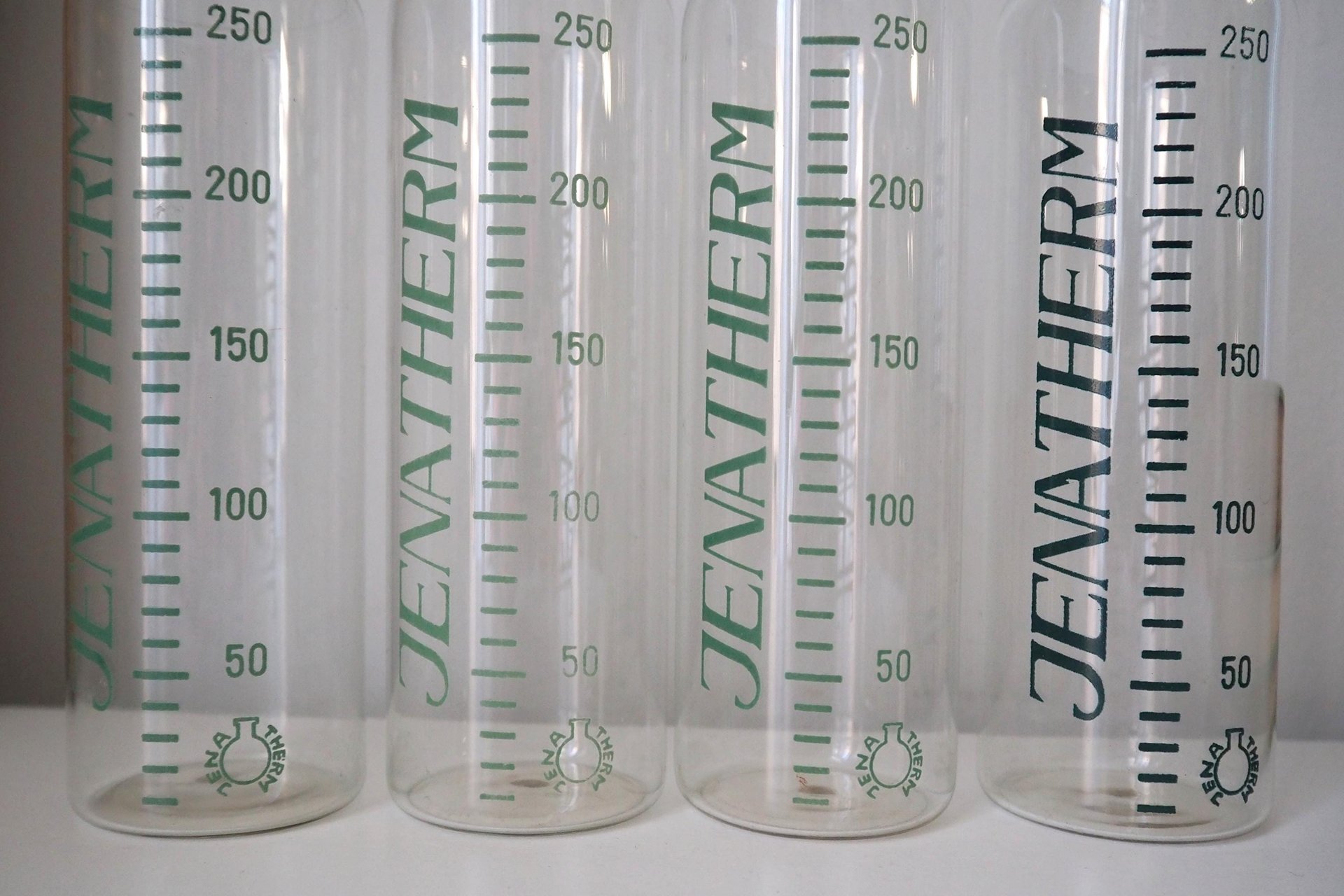 Set of four vintage glass bottles | Vintage Jenatherm laboratory bottles | Vintage apothecary bottles | Vintage glass vases